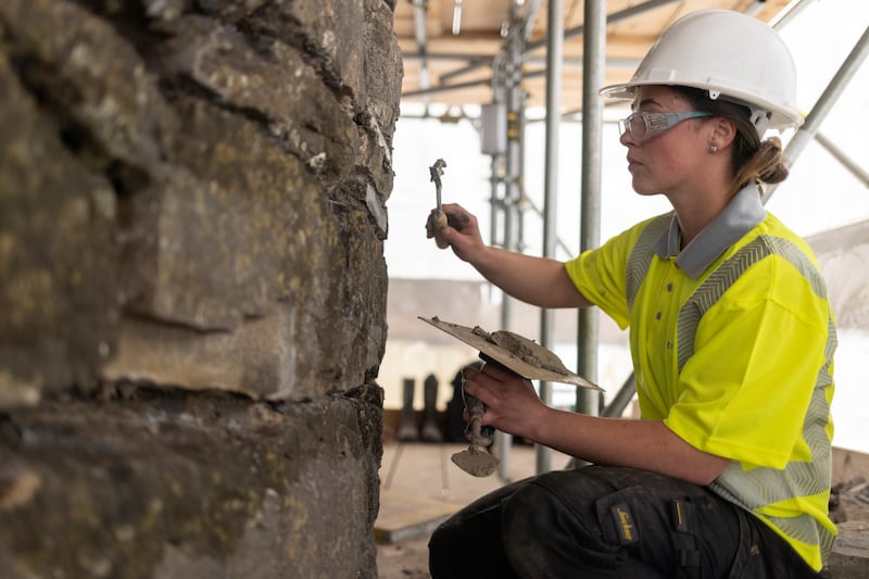 Megan Pepper repointing the tower