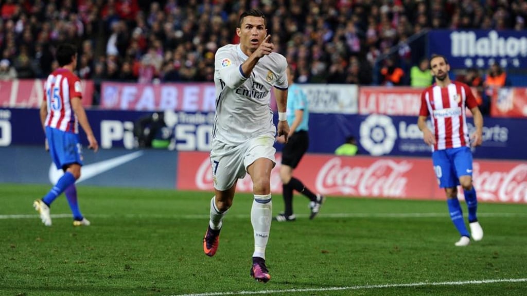 Cristiano Ronaldo celebrates after scoring Real Madrid’s second goal during the La Liga match against Atletico Madrid at Vicente Calderon Stadium. Photograph: Denis Doyle/Getty Images