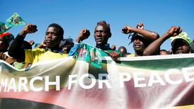 Zimbabwe’s president links former first lady to explosion at rally