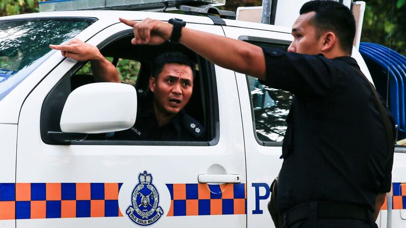 Royal Malaysian Police patrol near the ‘The Dusun’ resort, in Seremban, Negri Sembilan, Malaysia. Photograph: Fazry Ismail/EPA