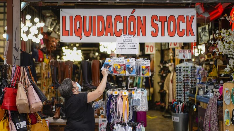 A worker arranges packets of protective face masks for sale at a shop in Madridon Tuesday. Photograph: Paul Hanna/Bloomberg