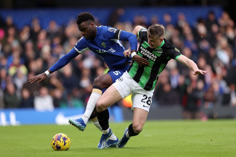 Benoit Badiashile of Chelsea battles for possession with Evan Ferguson of Brighton. Photograph: Alex Pantling/Getty