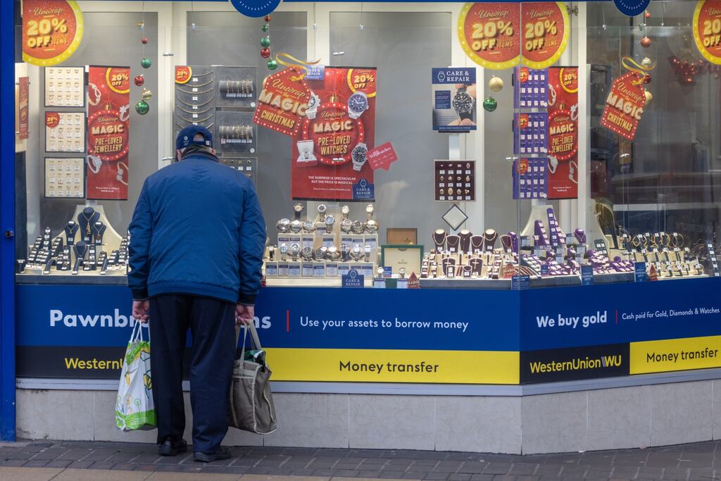 A shopper browses goods in a pawn broker in Bexleyheath in London earlier this week. Figures on Wednesday showed core inflation, which excludes energy and food prices, rose by 5.1 per cent in the year to November, compared with 5.7 per cent in the previous month. Photograph: Jason Alden/Bloomberg
