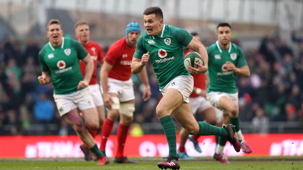 Jacob Stockdale runs in his second try against Wales at the  Aviva Stadium.  Photograph: Tommy Dickson/Inpho