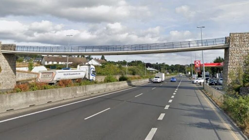 Gardaí in south Dublin received several complaints from members of the public about a group of people hanging large banners over the edge of the footbridge on the N11 at Kilmacanogue. Image: Google Maps