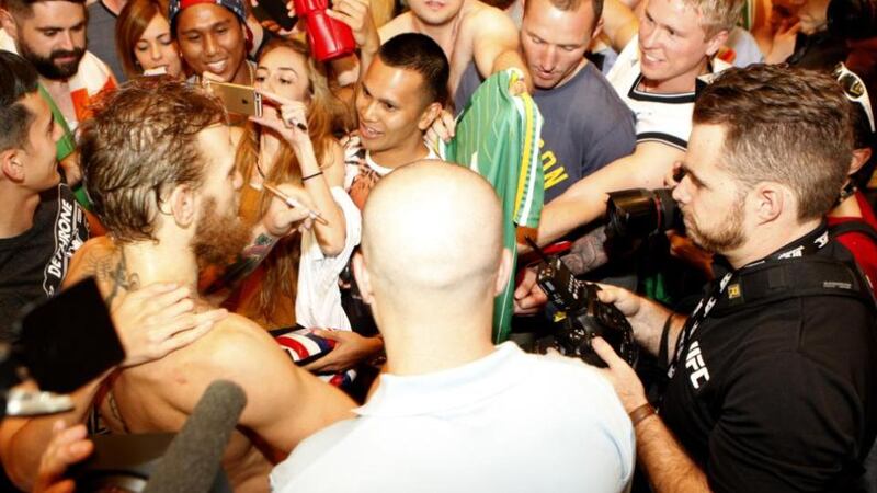 Conor McGregor signs autographs for Irish fans at the MGM Grand in Las Vegas. Photograph: Getty Images