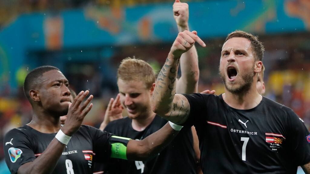 Austria’s Marko Arnautovic celebrates with teammates after scoring his side’s third goal during the Euro 2020 win over North Macedonia. Photo: Robert Ghement/Pool via AP