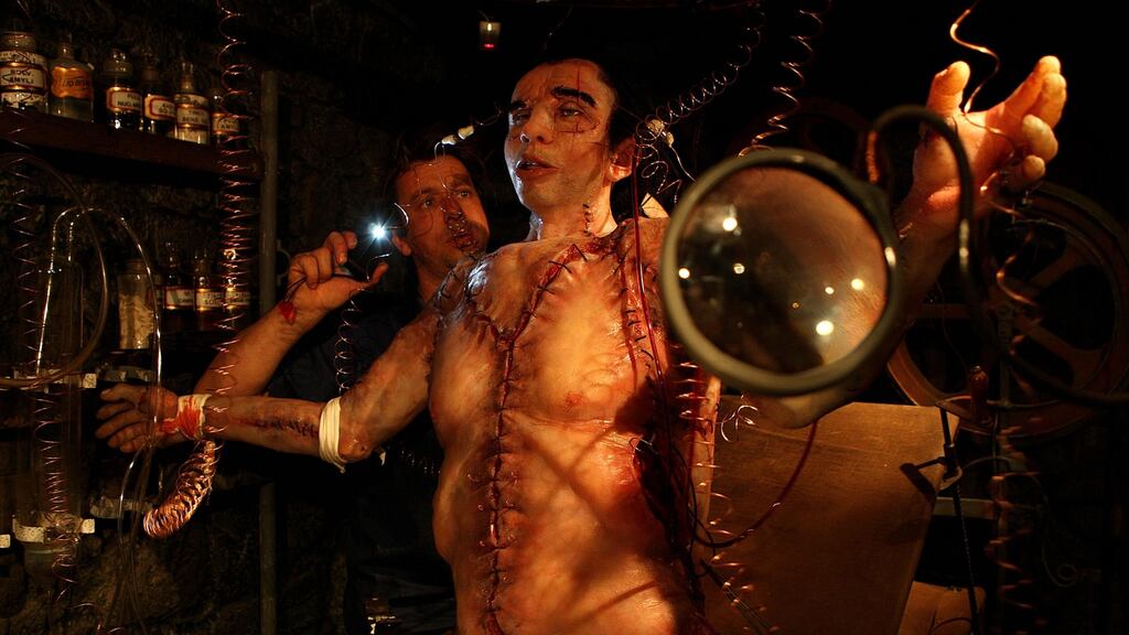 Wax artist Laurent Mellie with the waxwork of Frankenstein in the National Wax Museum Plus in Dublin. Photograph: Julien Behal/PA Wire