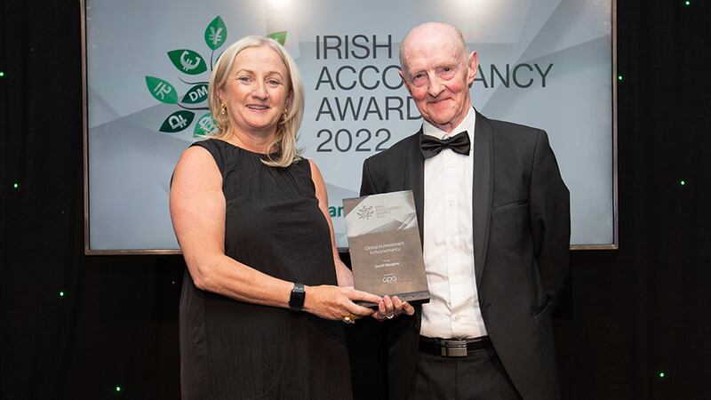 Aine Collins, president, The Institute of Certified Public Accountants in Ireland, presents the Global Achievement in Accountancy award to Geoff Meagher.