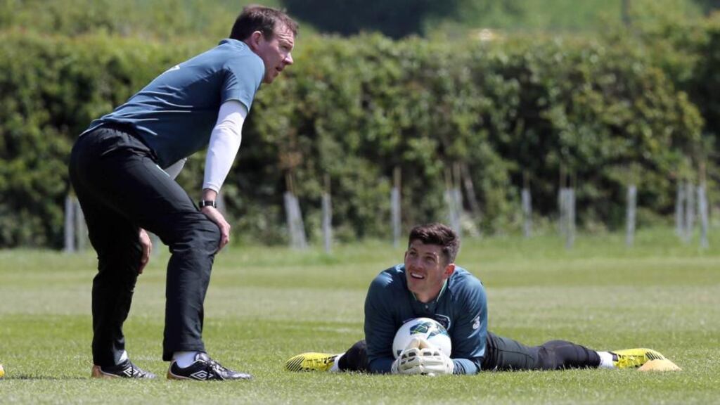 Goalkeeping coach Alan Kelly puts Keiren Westwood through his paces in London yesterday. Photograph: Donall Farmer/Inpho