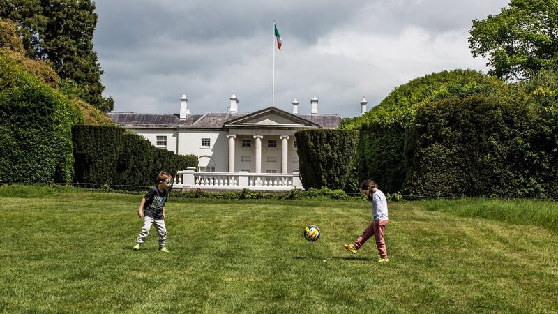 Max and Molly Roony are seen playing football in front of Áras an Úachtaráin this week in Phoenix Park. James Forde/ The Irish Times