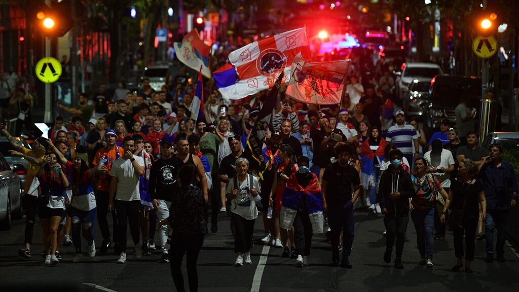 Crowds march in the streets of Melbourne following Novak Djokovic’s release from detention. Photograph: James Ross/EPA