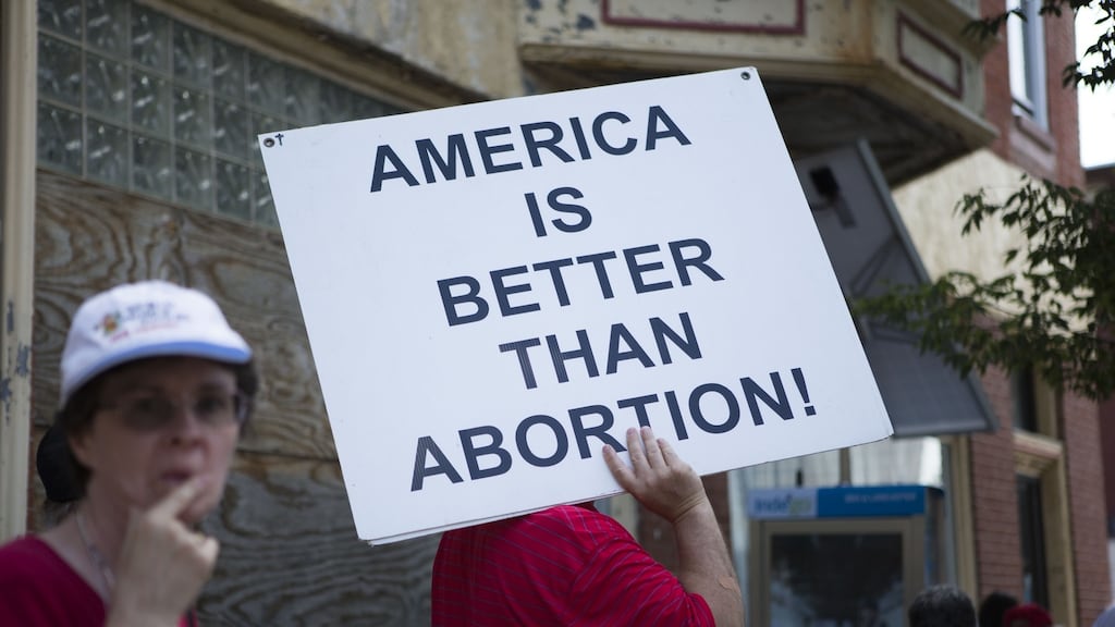 A Pro-Life Coalition of Pennsylvania rally outside Dr Kermit Gosnell’s closed abortion clinic in Philadelphia. Three years ago, Dr Gosnell was convicted of the first-degree murder of three infants, the involuntary manslaughter of a patient and other felony counts. Photograph: Jessica Kourkounis/Getty Images