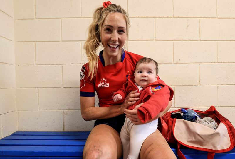 Eimear Considine with her son Caolán after the Energia All-Ireland Women's Cup Final between Railway Union and UL Bohemian. Photograph: Dan Sheridan/Inpho