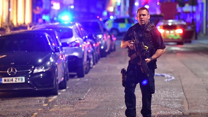 Armed police on Borough High Street in London as officers dealing with a “major incident” at London Bridge. Photograph: Dominic Lipinski/PA
