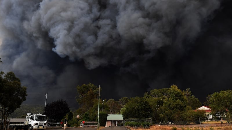 Smoke from bushfires rises into the air near Sydney, New South Wales. Temperatures above 40 degrees and strong winds are fanning a number of fires around Sydney. Photograph: EPA