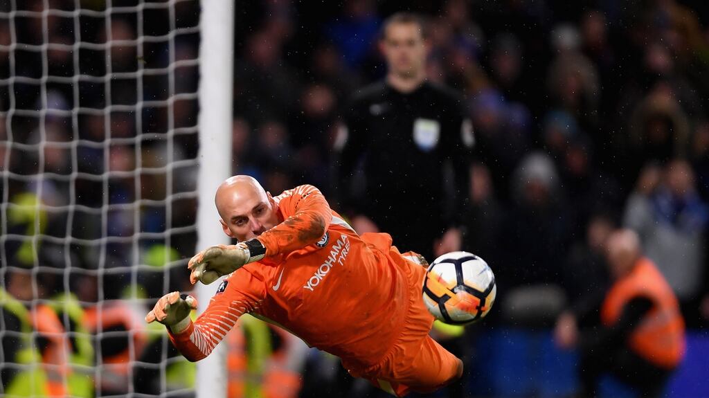 Chelsea goalkeeper Willy Caballero saves a penalty from Nelson Oliveira of Norwich City during the FA Cup third-round replay at Stamford Bridge. Photograph: Mike Hewitt/Getty Images