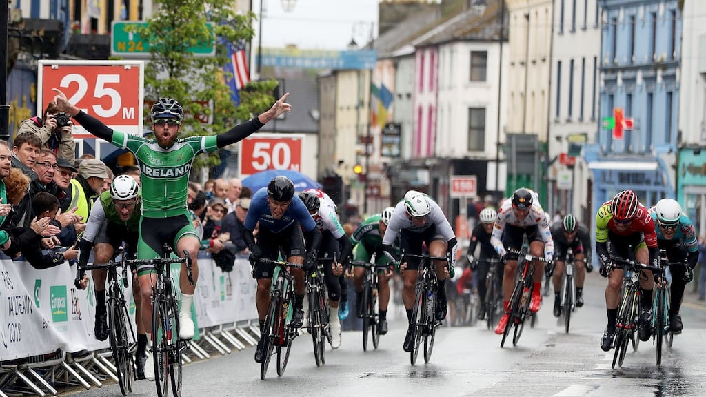 Robert-Jon McCarthy celebrates victory in stage two of the Ras. Photograph: Bryan Keane /Inpho