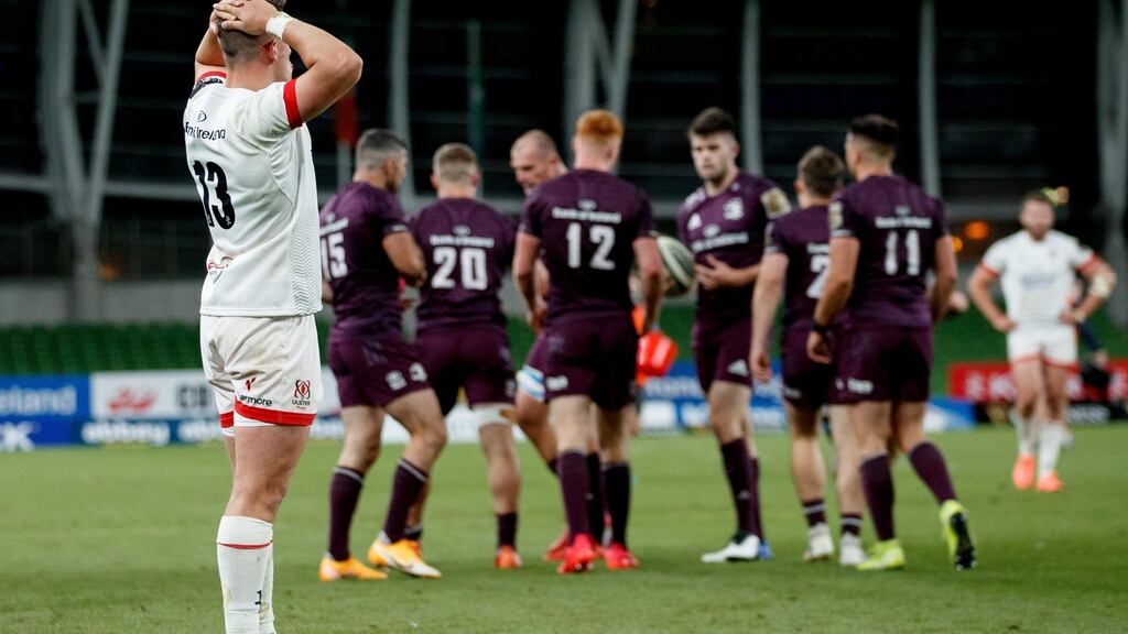 Ulster’s James Hume looks on following Scott Penny’s try for Leinster. Photograph: James Crombie/Inpho