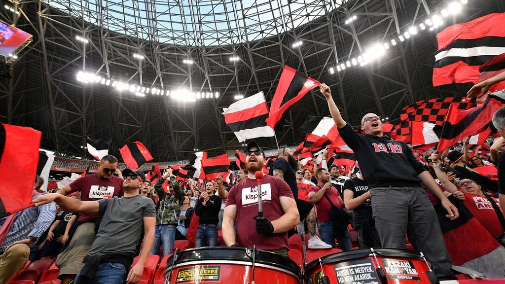 Budapest Honved fans sing ahead of the Hungarian Cup Final against Mezokovesd Zsory FC in the Puskas Ferenc Arena in Budapest. Photo: Zsolt Szigetvary/EPA