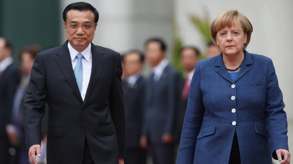 German chancellor Angela Merkel welcomes Chinese prime minister Li Keqiang upon his arrival at the Chancellery in Berlin yesterday. Photograph: Sean Gallup/Getty Images