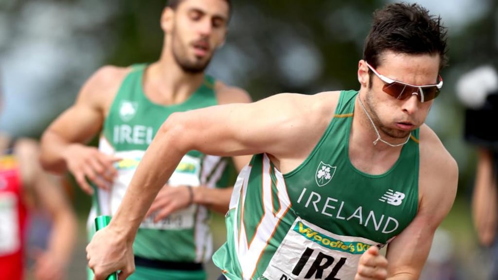 Ireland’s Brian Gregan takes the baton on the last leg of the 4x400m relay. Photograph: Ryan Byrne/Inpho