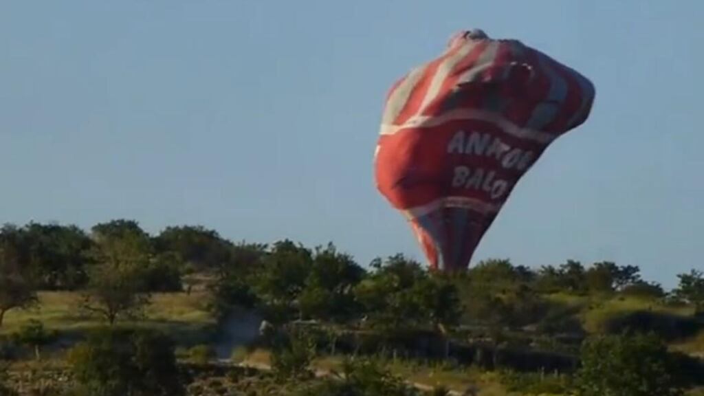 A screen grab from a video shot by Canadian tourist E Wayne Ross shows an Anatolian Balloons Company hot air balloon crashing near Göreme National Park and the Rock Sites of Cappadocia in central Turkey today. Photograph: E Wayne Ross