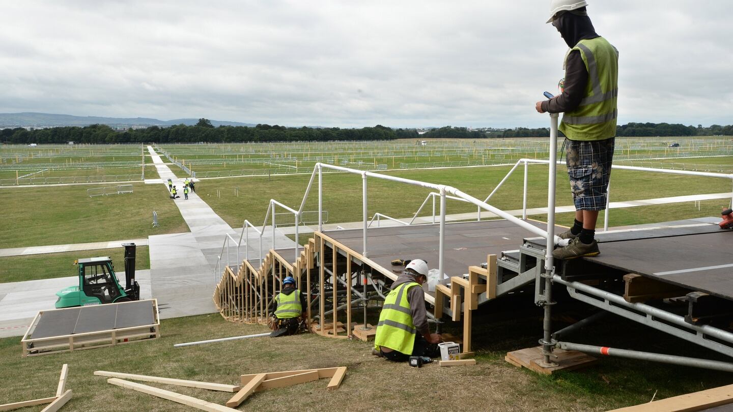 Work continues near the altar during a Media visit the site for an informal briefing on arrangements in the Phoenix Park for closing Mass with Pope Francis. Photograph: Dara Mac Dónail
