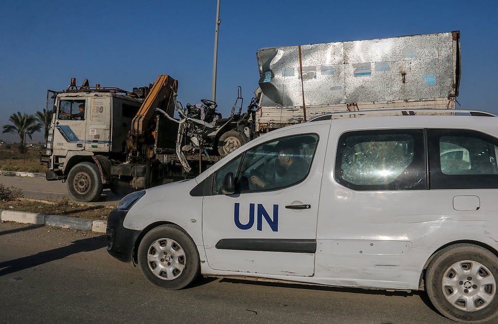 A truck that had been used by Unrwa workers is loaded onto another truck after it was destroyed and two Palestinian workers were killed in an Israeli air strike on Salah Al Dine road between Deir Al Balah and Khan Younis in the Gaza Strip last week. Photograph: Mohammed Saber/EPA