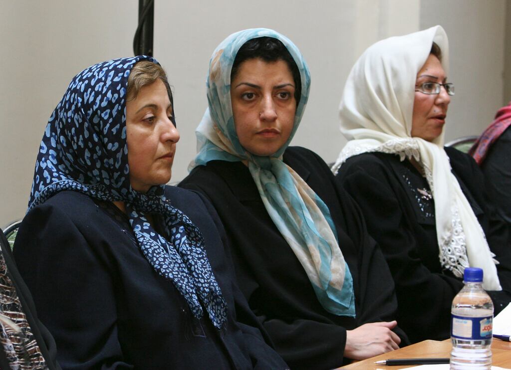 Narges Mohammadi, centre, sits next to Nobel Peace Prize winner Shirin Ebadi, left, while attending a meeting on women’s rights in Tehran. File photograph: AP