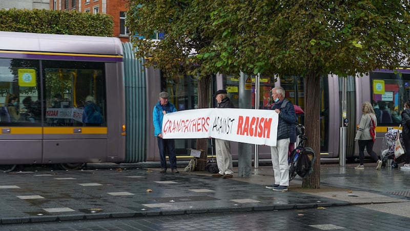 From left, grandfathers Benny McCabe, Kevin Crian and Ronan Wilmot near the Spire in Dublin. Photograph: Enda O’Dowd