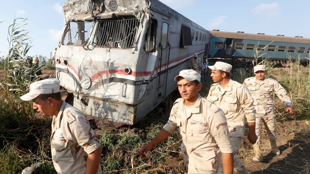 Soldiers at  the scene of a major train crash just outside Egypt’s Mediterranean port city of Alexandria on Friday. Photograph: Ravy Shaker/AP Photo