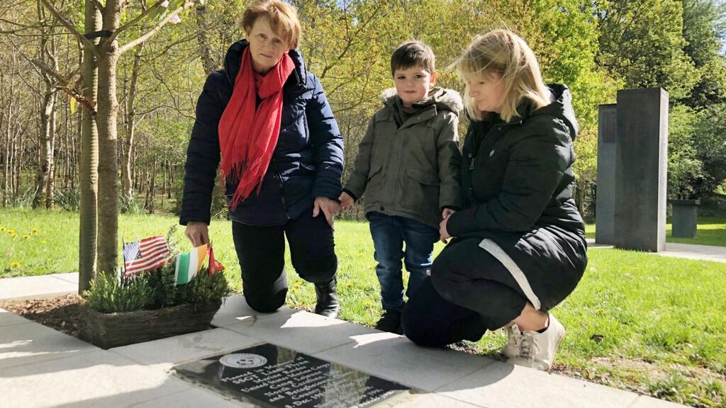 Ann Flynn with her daughter Norma Flynn and grandson Tadhg Gleeson at the memorial in Donadea Forest Park to her Kildare-born US marine son Liam Flynn who was killed in 2015. Photograph: Alan Betson