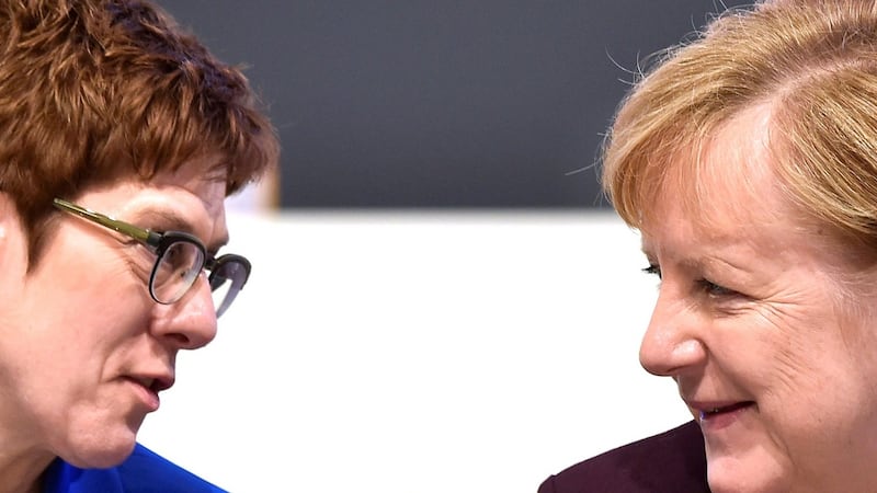 Annegret Kramp-Karrenbauer and Angela Merkel: The former was seen as the candidate most likely to continue the current German chancellor’s centrist course. Photograph: Matthias Rietschel/Reuters