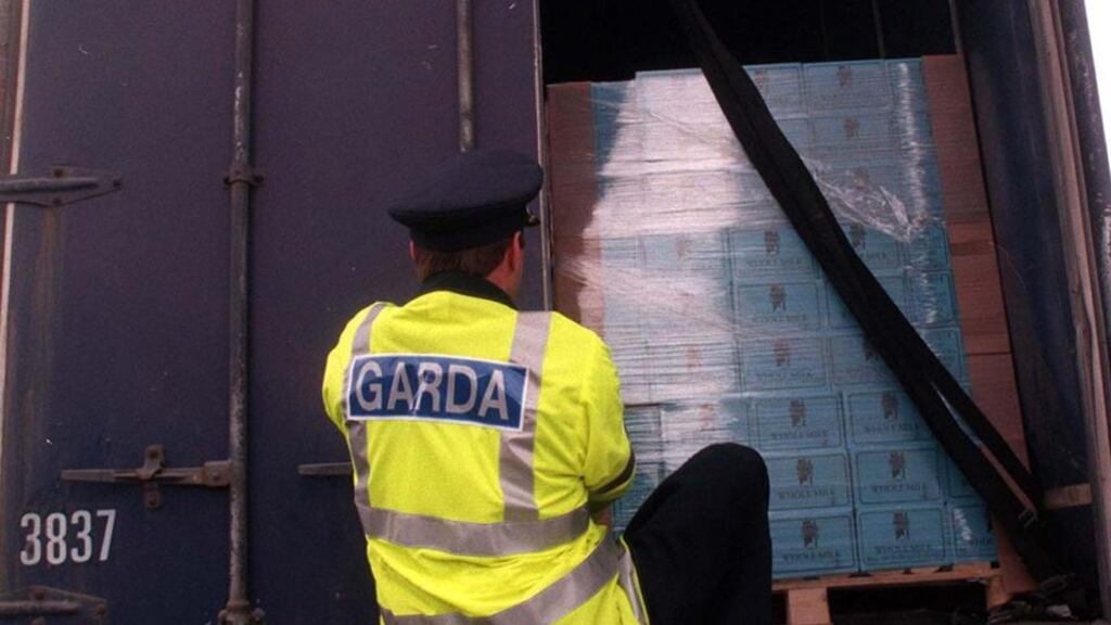 A garda searching a heavy goods vehicle at a checkpoint on the Cavan/Fermanagh Border. Photograph: Eric Luke