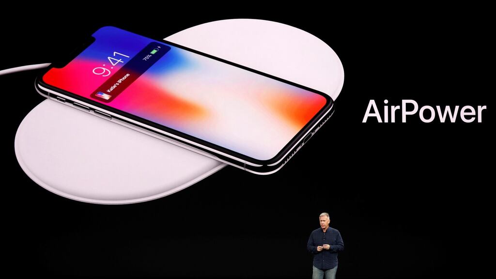Apple senior vice-president of worldwide marketing, Phil Schiller, shows the AirPower wireless charging mat during an event in Cupertino, California, in 2017. Photograph: Reuters