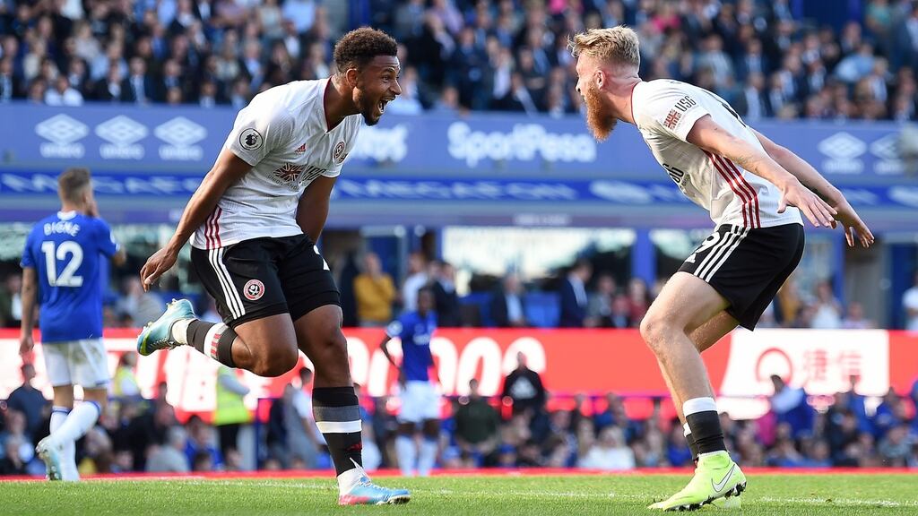 Lys Mousset of Sheffield United celebrates after scoring his team’s second goal with Oliver McBurnie during the Premier League match against  Everton  at Goodison Park. Photograph: Nathan Stirk/Getty Images