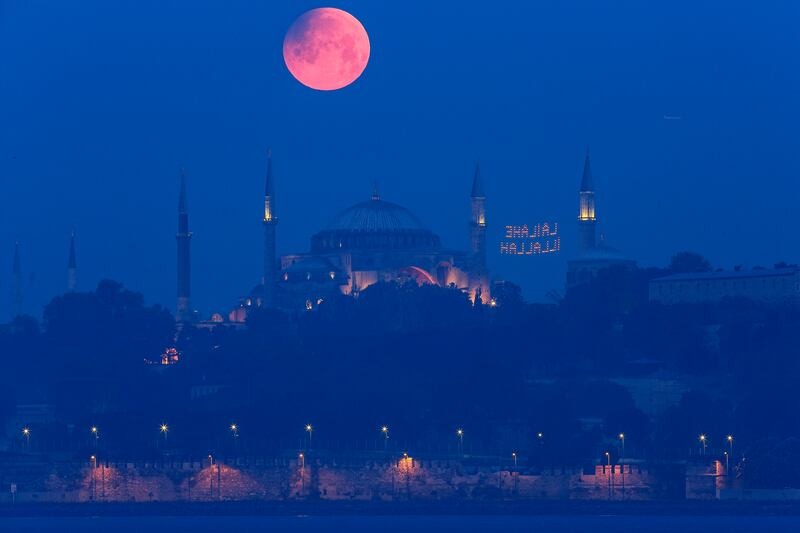 A full moon rises above the Hagia Sophia in Istanbul, Turkey. Photograph: Mucahid Yapici/AP
