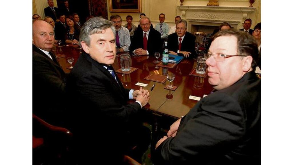 Taoiseach Brian Cowen (right) and British prime minister Gordon Brown (centre) during talks at Hillsborough Castle yesterday. Photograph: Paul Faith/Reuters