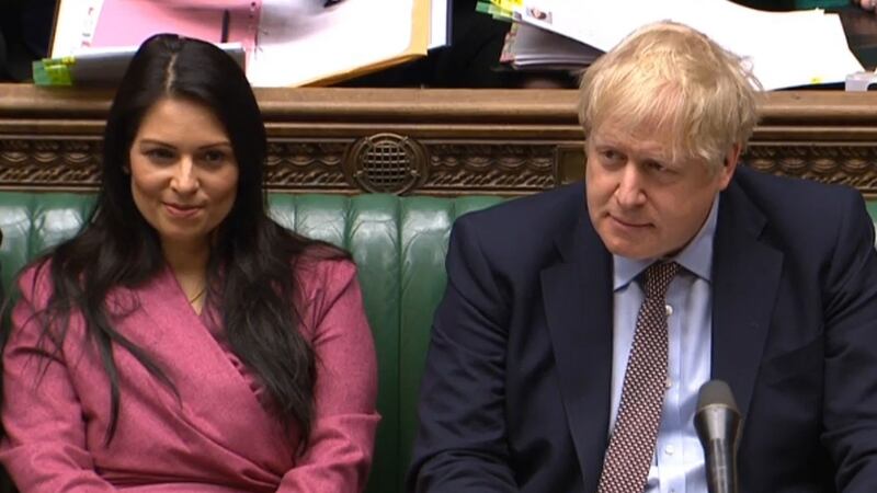A videograb shows Britain’s prime minister Boris Johnson  sitting next to home secretary Priti Patel  during prime minister’s questions in the House of Commons in London. Photograph: AFP via Getty Images