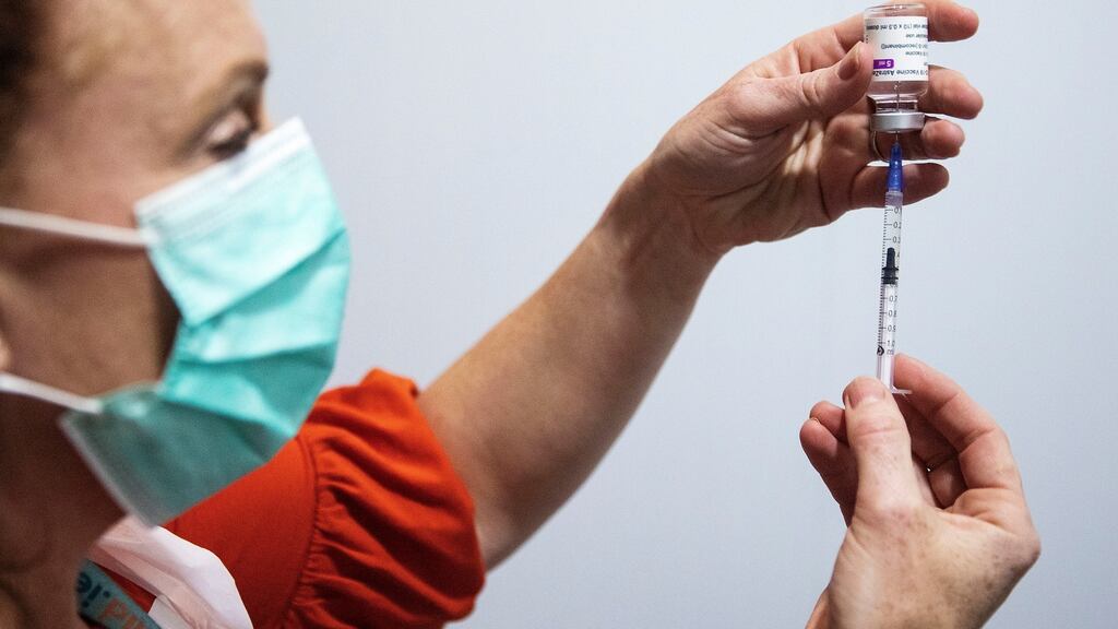 Public health nurse Deirdre Murphy with a vial of the AstraZeneca Covid-19 vaccination at the mass vaccination centre in the Helix, DCU, Dublin. Photograph: Brian Lawless/PA Wire