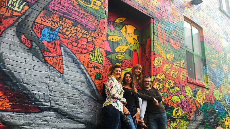 Fiona Hobler (third left), and friends at Graffiti Alley in Toronto