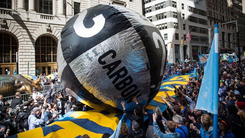 Fossil-fuel divestment: climate-change protesters take a carbon bubble down Wall Street. Photograph: Andrew Burton/Getty