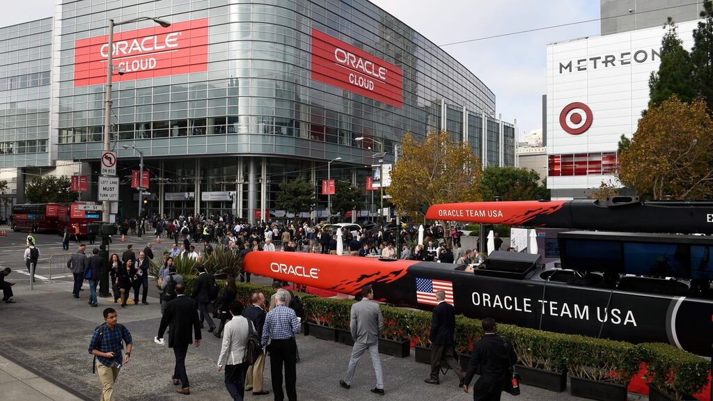 Attendees view Oracle’s Team USA’s AC72 catamaran at Oracle Cloud Plaza on Howard Street during the OpenWorld conference in San Francisco