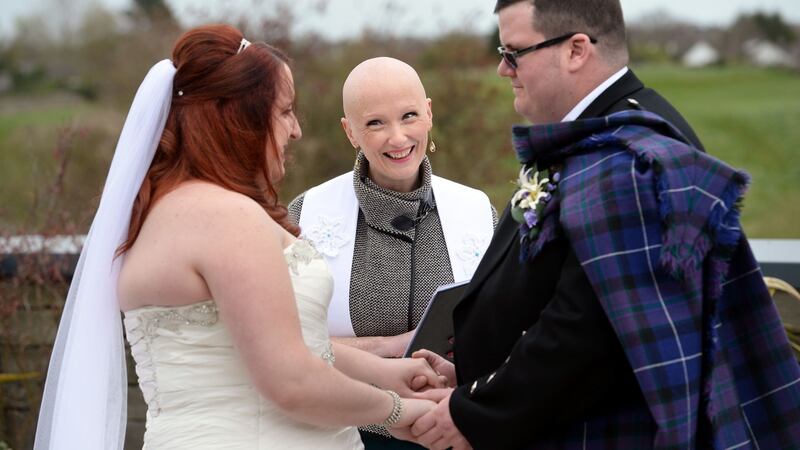 Rev Karen Dempsey performing the wedding ceremony of Ashley and Gary Zanavich, at Trim Castle Hotel, Co Meath. Photograph: Dara Mac Dónaill