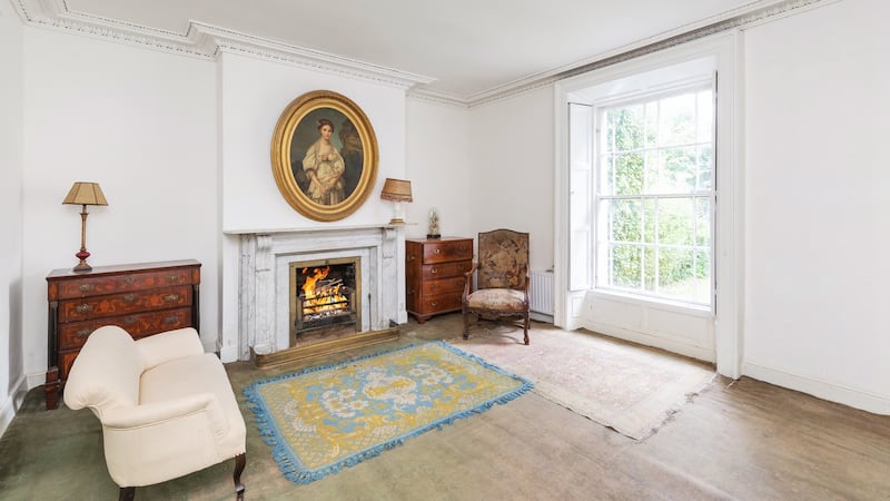 The drawingroom features a large white marble fireplace
