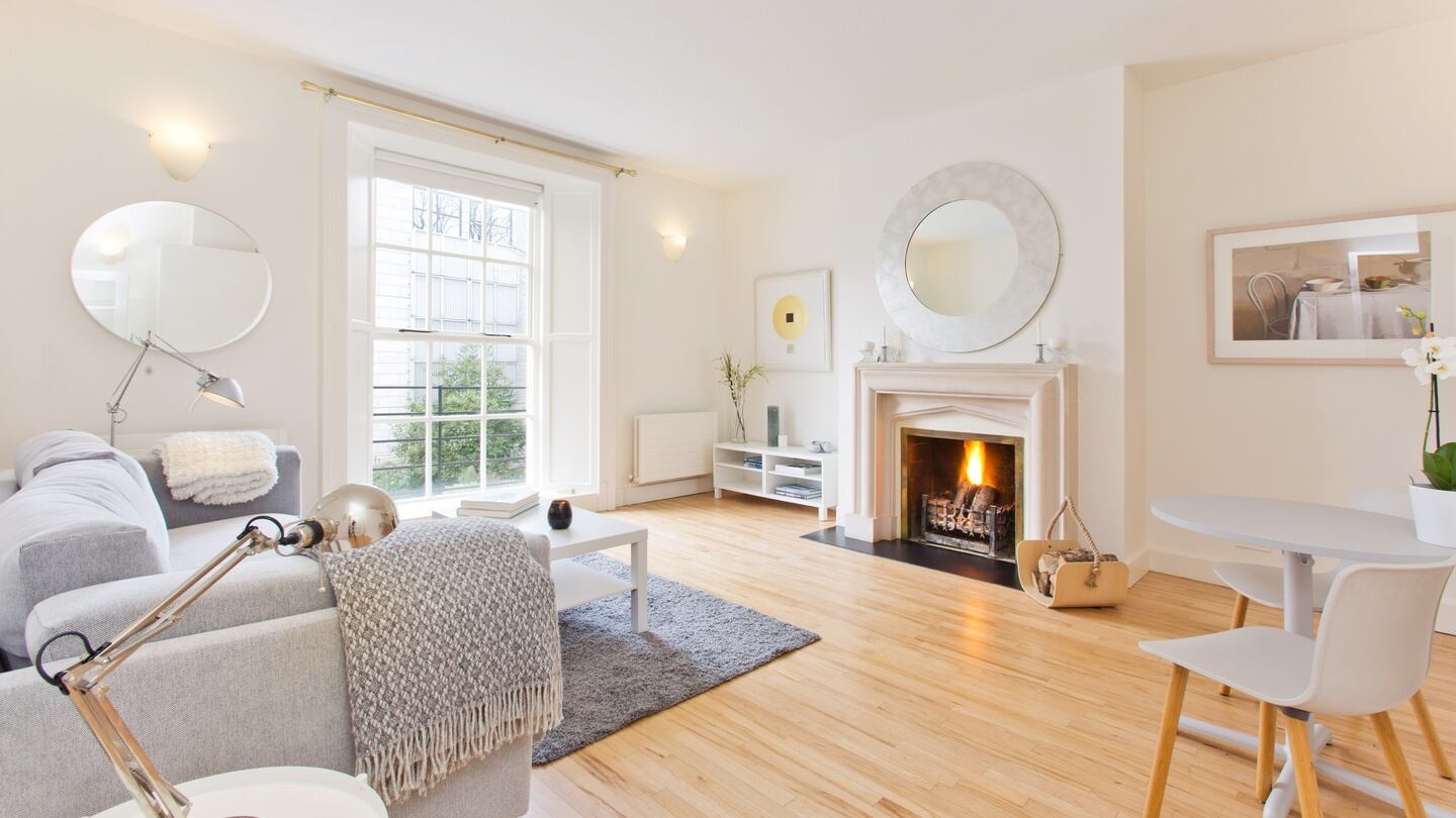 Livingroom with open fireplace at apartment No 2, 11 Harcourt Terrace, Dublin 2
