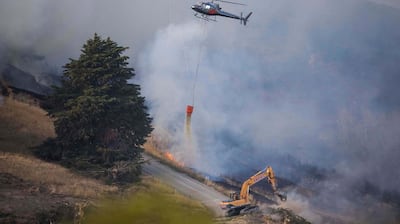 Emergency services fighting the Port Hills fire on the outskirts of Christchurch. Photograph: EPA