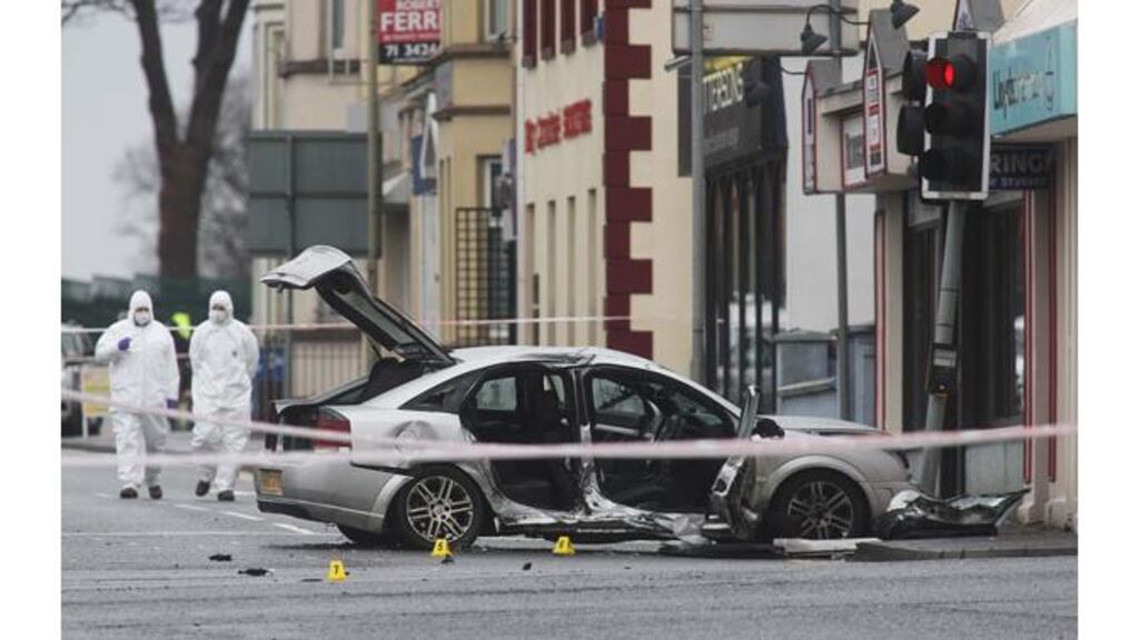 Forensic police officers at the scene of a car crash in which a policewoman was killed on the Limavady Road, Derry. Photograph: PA