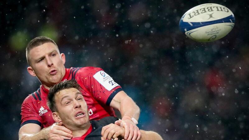 Munster’s Andrew Conway battles for possession with Alex Lewington of Saracens during the Heineken Champions Cup match at Thomond Park. Photograph: Oisín Keniry/Inpho